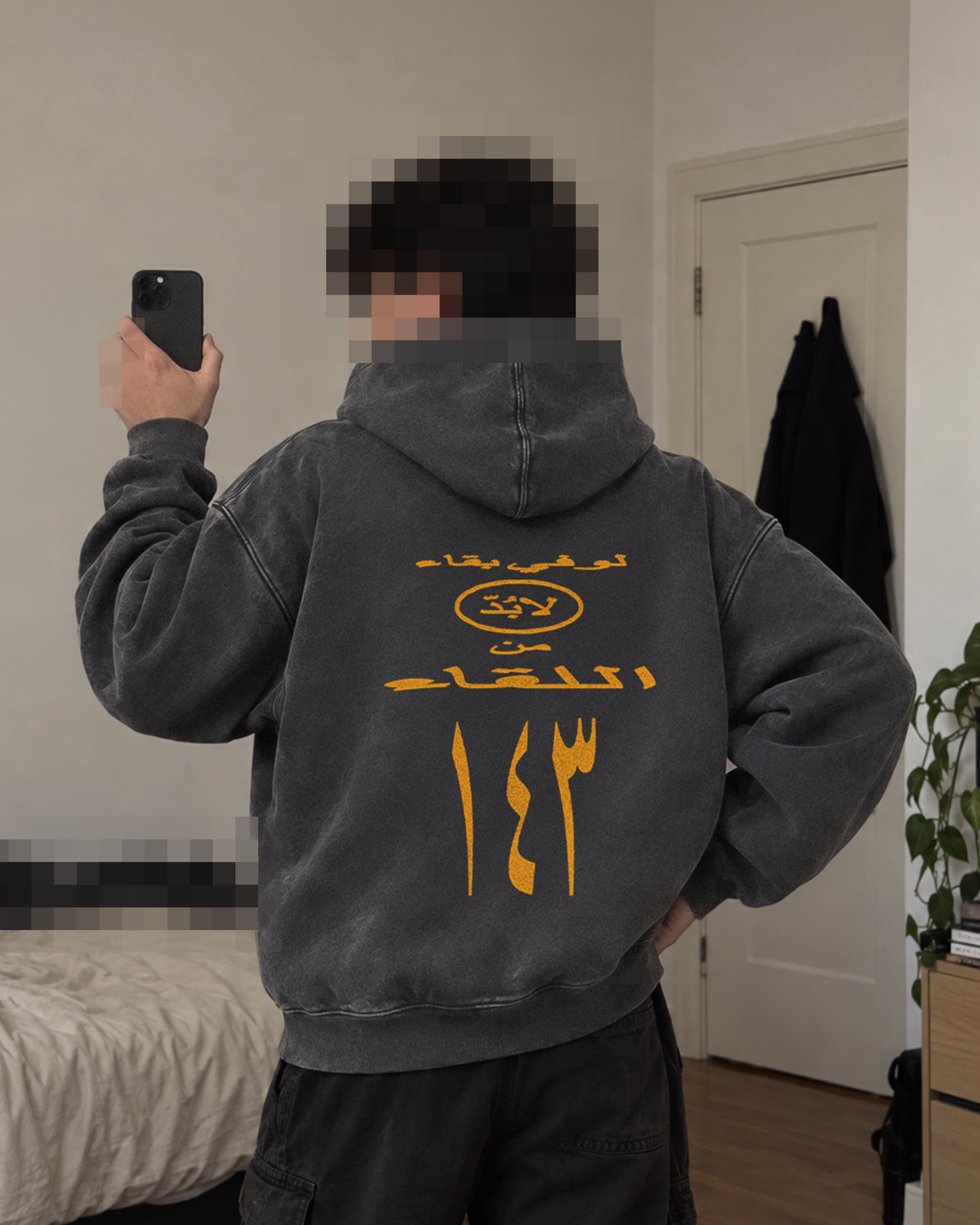 143 Washed Hoodie — back view on model in dark grey