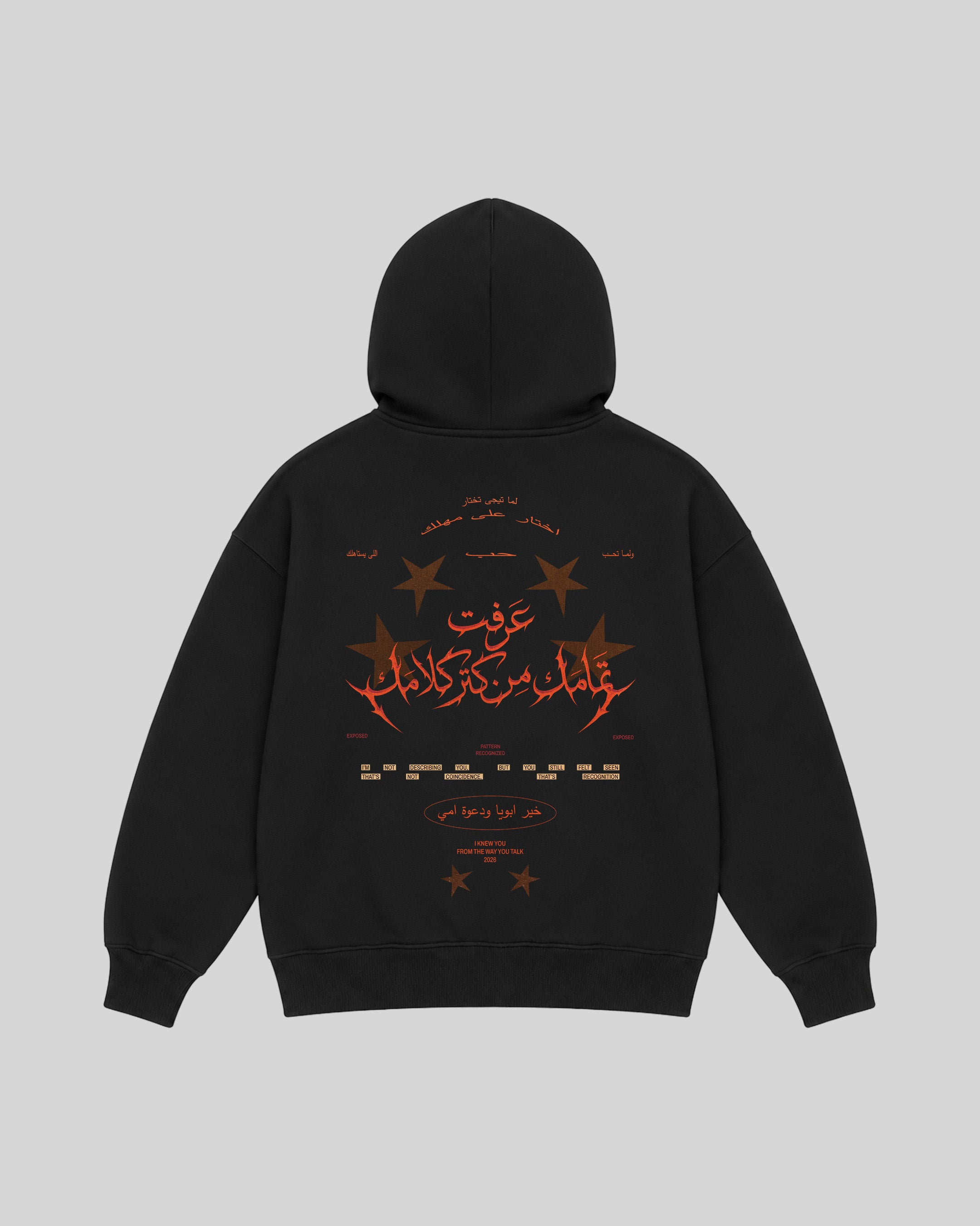 All Talk Hoodie in black, back view with Arabic typography