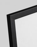 Close-up detail of the black 2 cm poster frame