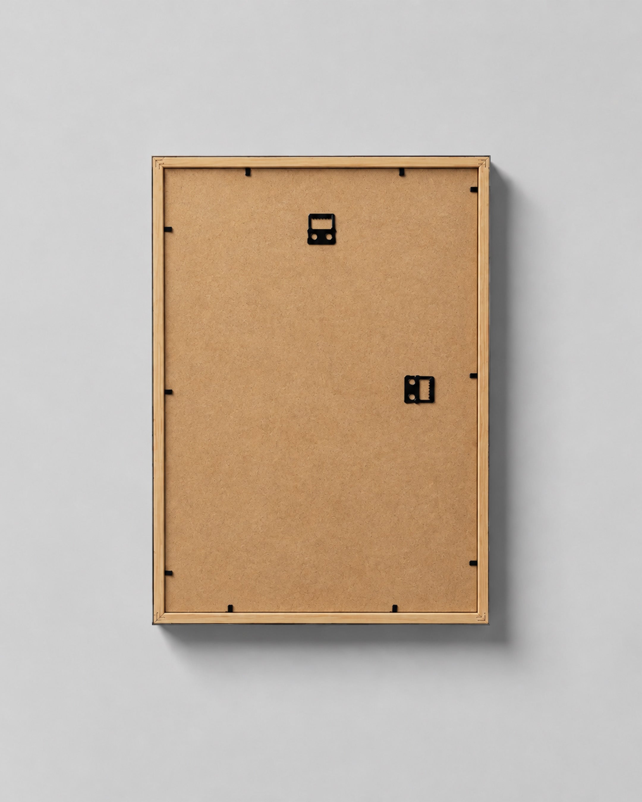 Back of the framed poster with vertical and horizontal hanging hardware