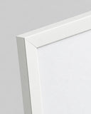 Close-up detail of the white 2 cm poster frame